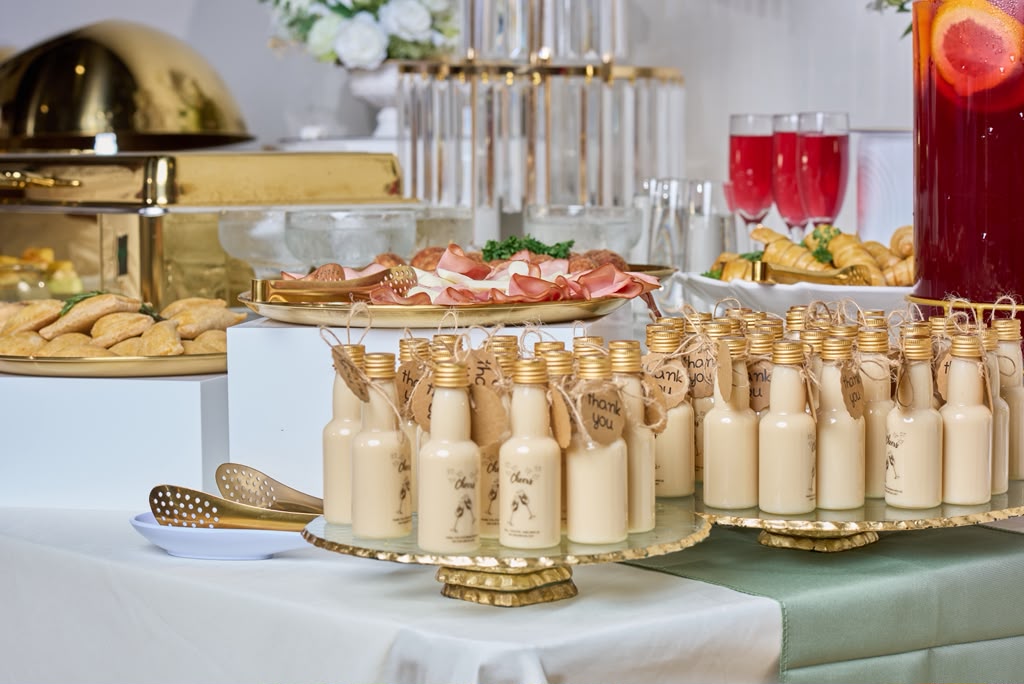 Styled brunch grazing spread with gold cloche domes and mimosas