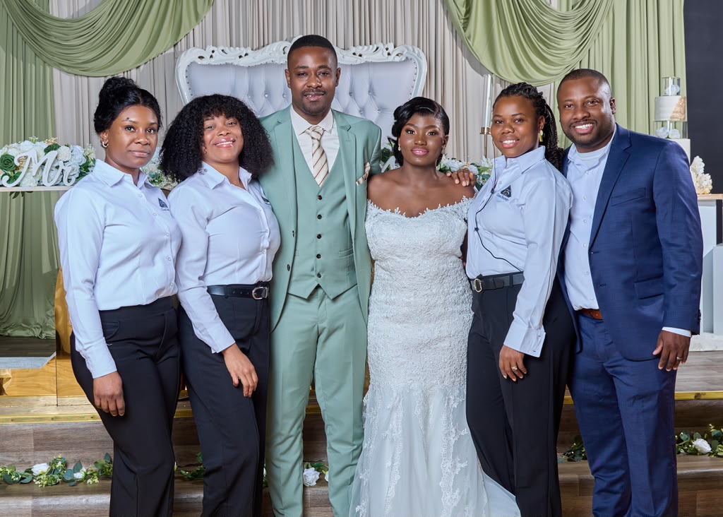 Newlyweds with the full Casa-Secreta event planning team at their Atlanta wedding