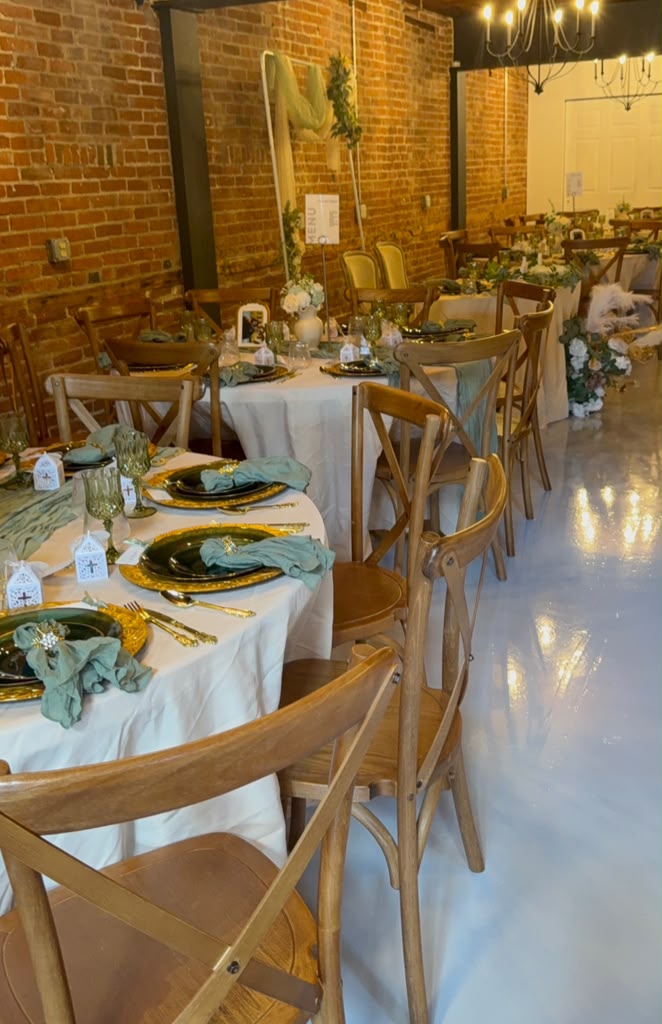 Elegant wedding reception hall with long banquet tables and greenery in metro Atlanta
